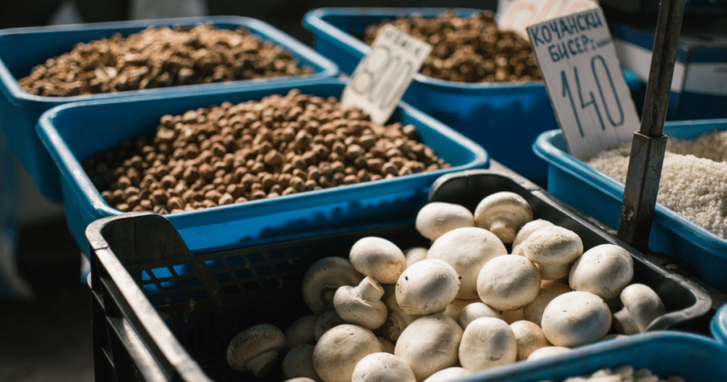 Mushrooms in trays being sold at a market